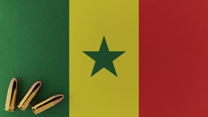 Three 9mm bullets in the bottom left corner on top of the national flag of Senegal