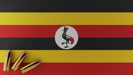 Three 9mm bullets in the bottom left corner on top of the national flag of Uganda