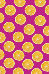 Orange slices pattern on a dark pink background, Contemporary flat lay food art 
