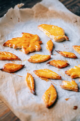 baking cookies in the form of autumn leaves on parchment paper