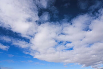 Clouds on light and dark sky