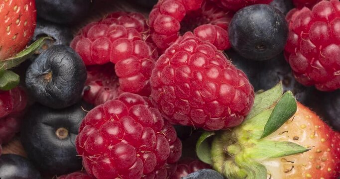 Berries closeup backdrop. Strawberry, raspberry and bluberry