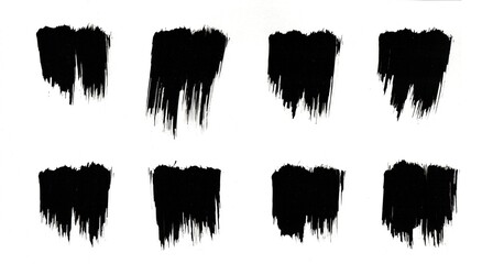 Black paint brush strokes made of watercolor on paper.
