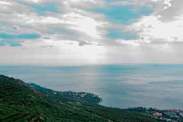 Beautiful sunbeam from cloudy sky, picturesque landscape