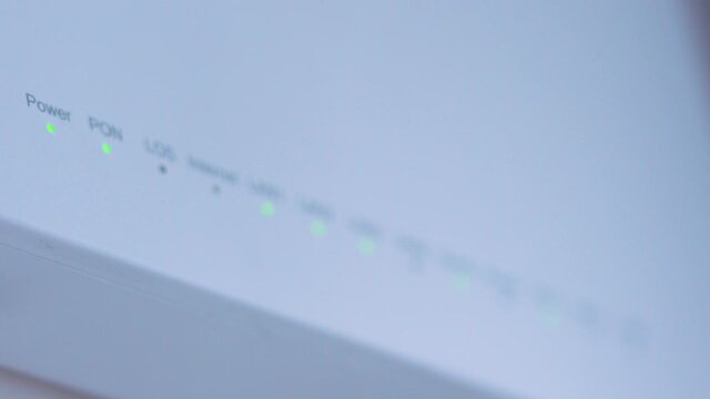 Close-up view of Internet wi-fi router device. Icons on the Wi-Fi router indicating the signal and connection. Wi-Fi modem router. Fast internet modem device