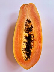 ripe papaya, cut in half papaya, seeds of ripe papaya, juicy orange fruit, natural vitamins, healthy fruit
