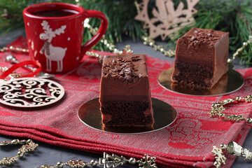 Chocolate brownie with raspberry confit and coffee mousse covered gourmet chocolate glaze on new year background.