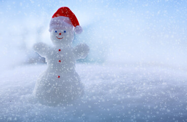 Happy snowman stand in white snow. Winter christmas landscape.