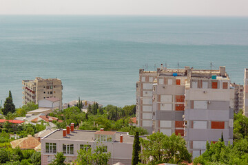 Awesome view on settlement located on a seashore. View from mountain