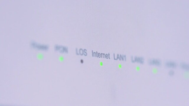 Close-up view of Internet wi-fi router device. Icons on the Wi-Fi router indicating the signal and connection. Wi-Fi modem router. Fast internet modem device