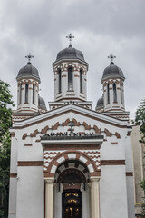 Fototapeta na wymiar Zlatari Church (Biserica Zlatari, XIX century) - small Orthodox church in the historic center of Bucharest on Victory Avenue (Calea Victoriei). Bucharest, Romania.