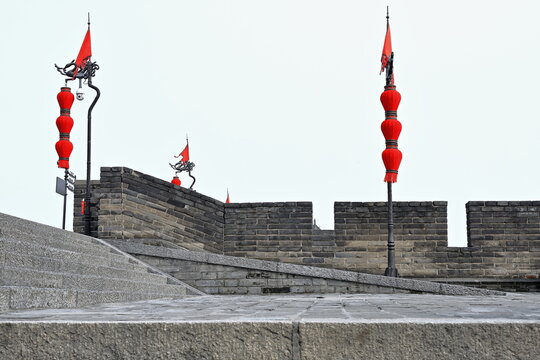 Chinese red lanterns-red flags-battlements and walkway-City Wall's Yongning-South Gate. Xi'an-China-1592