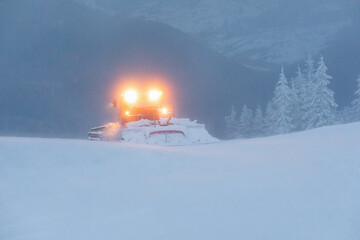 Snowblower. Snow removal vehicle in the mountain. Cleaning from snow. Winter. Wallpaper background....