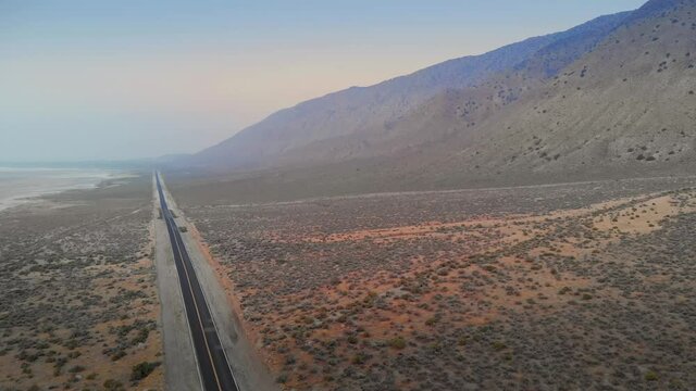 Aerial: Desert highway and the Black Rock Desert, home of the Burning Man Festival, Gerlach, Nevada, USA