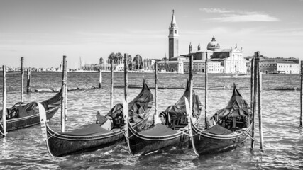 Fototapeta na wymiar Romantic gondolas moored in Venice