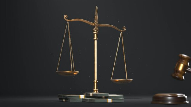 Footage with gold scales of justice and wooden gravel at the black background.