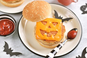Funny monster chicken burger with with toast cheese. Halloween food.