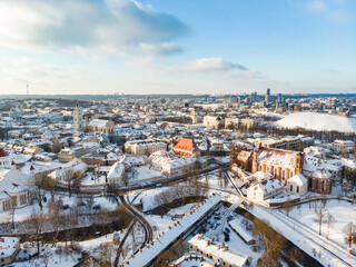 Beautiful Vilnius city panorama in winter with snow covered houses, churches and streets. Aerial view. Winter city scenery in Vilnius, Lithuania.