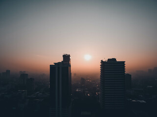 sunset over city in central of. Bangkok, Thailand.