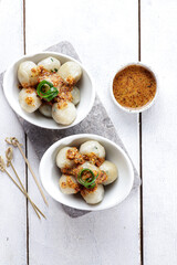 Cilok is West Java Indonesia traditional snack made from tapioca flour, served with peanuts sauce.