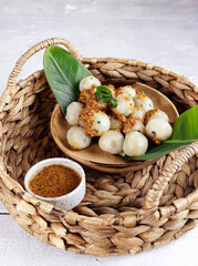 Cilok is West Java Indonesia traditional snack made from tapioca flour, served with peanuts sauce.