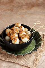 Cilok is West Java Indonesia traditional snack made from tapioca flour, served with peanuts sauce.