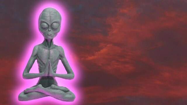 Glowing Alien praying and doing yoga in front of flying clouds during sunset with burning sky