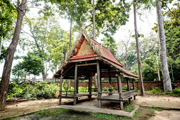 Fototapeta na wymiar Ancient wooden pavilion at Wat Khanon A temple famous for showing the UNESCO award-winning Nang Yai in Ratchaburi, Thailand.