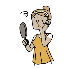 日焼けした顔にびっくりしている女性