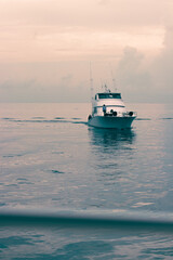 Yacht on the Caribbean Sea during sunset in Jamaica.
