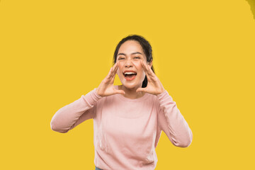 portrait of woman screaming holding two hands near mouth