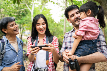happy family with backpacks taking selfie by smartphone and hiking.Tourism, adventure and summer vacation concept