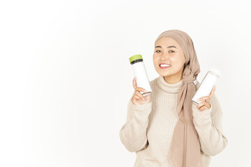 Showing and presenting blank bottle of Beautiful Asian Woman Wearing Hijab Isolated On White Background