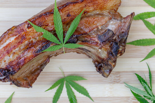 cannabis food with bbq pork ribs grilled with herbs spices served