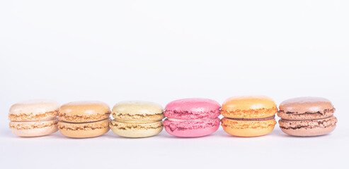 Colorful Sweet Macarons in a Row isolated on White Background 