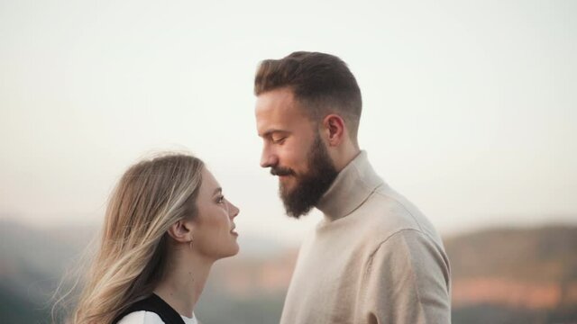 Bearded Man Looking So In Love At His Blond Girlfriend With Shallow Depth Of Field. Closeup