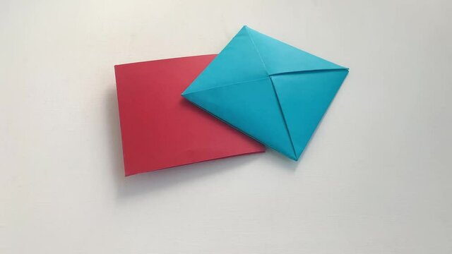 Korean paper flip cards. Close up of throwing and flipping cards in slow motion. Isolated on white background.