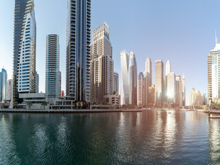 Fototapeta na wymiar Cityscape and skyscraper at sunset in Dubai Marina. 