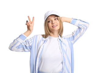 Happy beautiful woman in visor hat showing victory gesture on white background