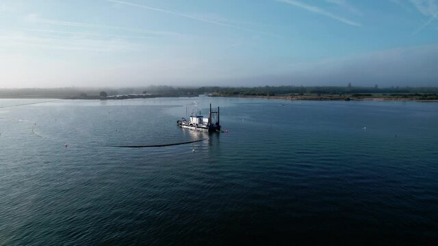 4K Drone Footage Orbit Around Ferry Crossing Bassin d'Arcachon in France.