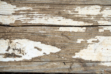 faded peeling white paint on old wood