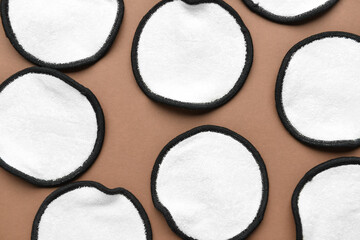 Reusable cotton pads on brown background