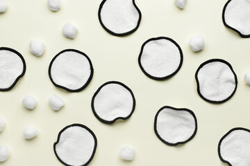 Reusable cotton pads and balls on light background