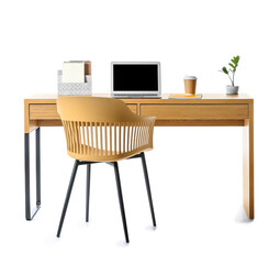 Wooden table with organizer, laptop, paper cup of coffee, houseplant and chair on white background