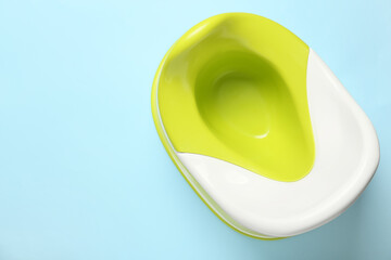 Green and white potty on color background