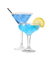 Glasses of Blue Lagoon cocktail on white background