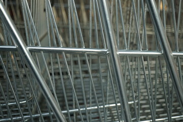 Macro of metal grilles of shopping carts