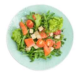 Tasty salad with fish in plate on white background