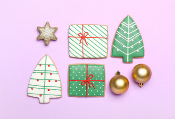 Delicious Christmas cookies with decor on color background