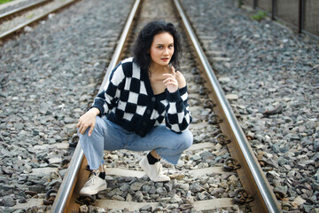 Portrait of 20s Asian Woman brown hair wear jacket high fashion make up under blue sky cloud